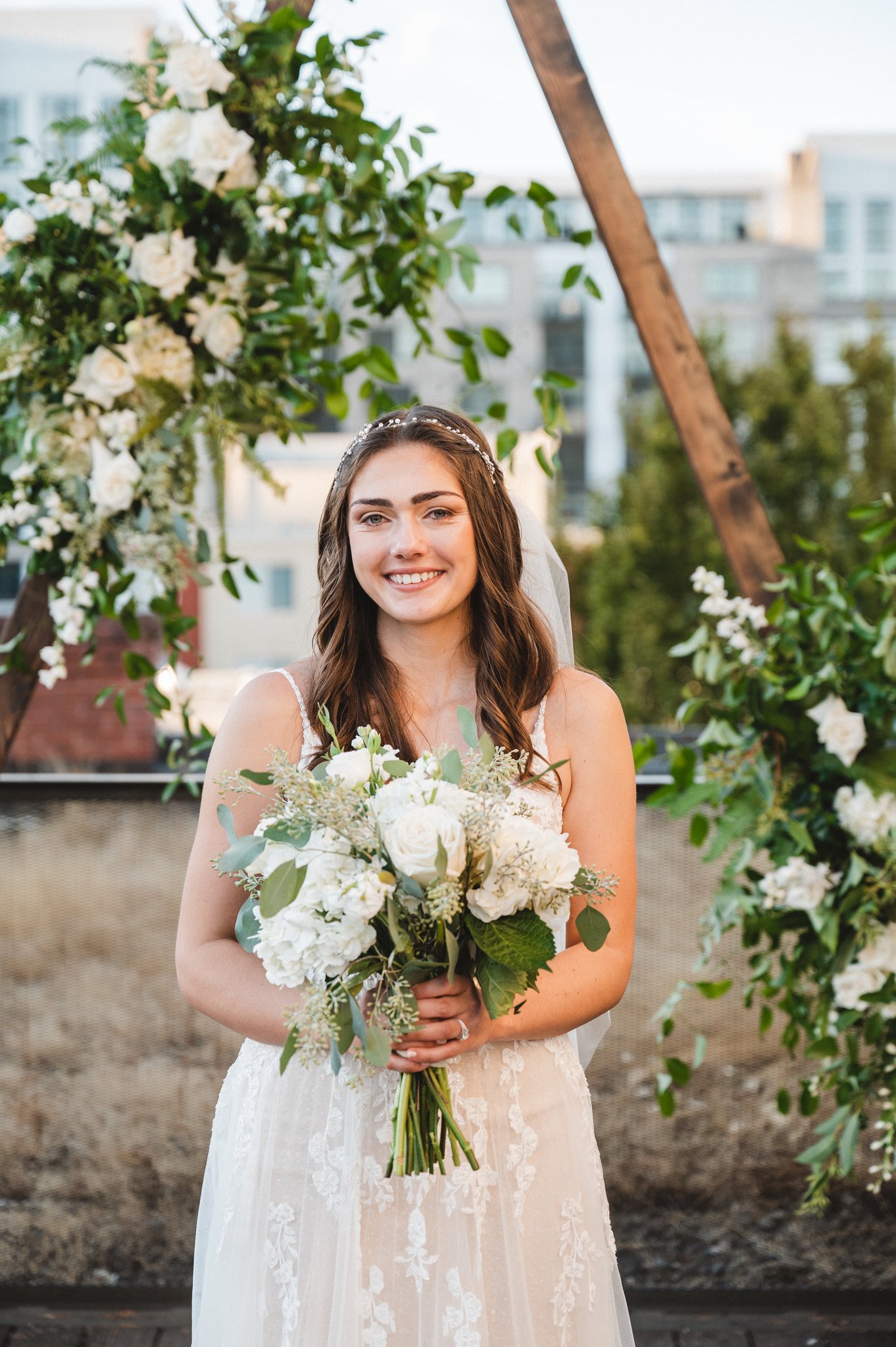 Bride with soft flowing hair and natural makeup done by Blushing Flower Events